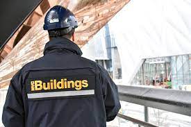 Image of the back of a NYC department of buildings employee.